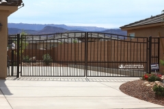 arched gate with dog guard pickets