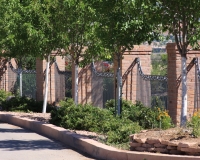 curved fence with cast scrolls