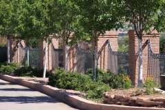 curved fence with cast scrolls